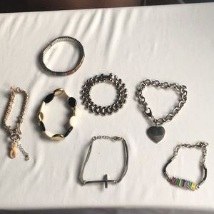 7 vintage bracelets. Silver toned/gold ton…